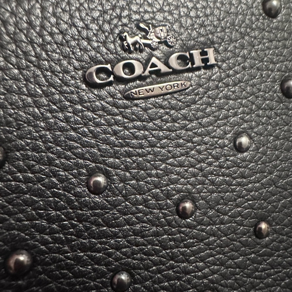 Beautiful Coach Black Zip Wallet with hematite Rivets, and studded detailing.
